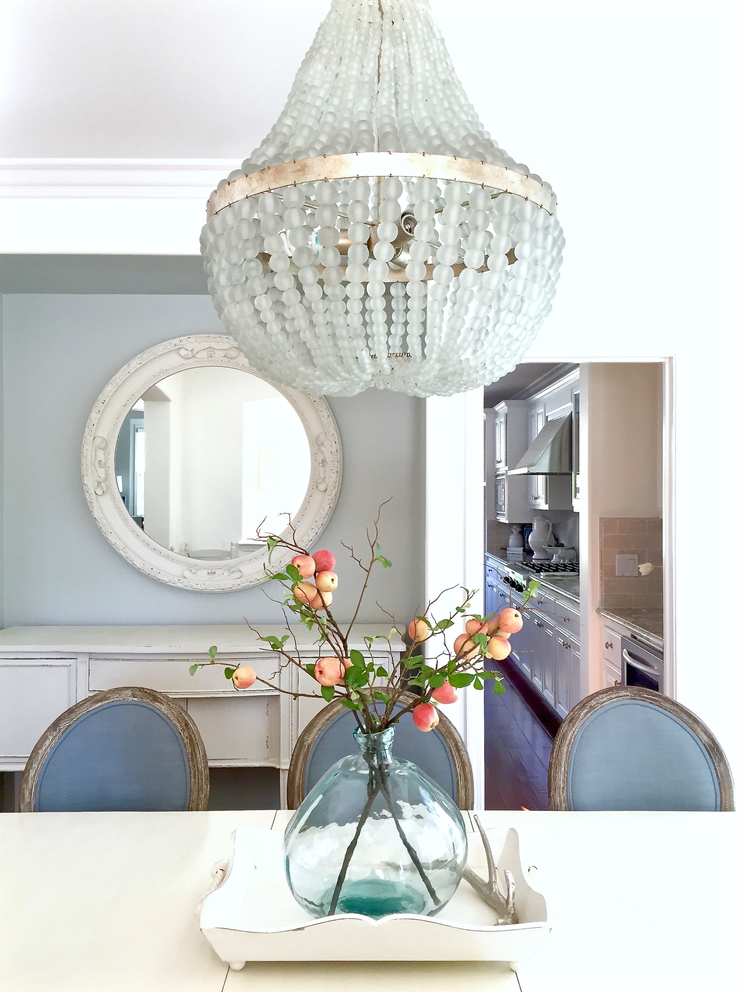 Blue and white dining room with Edisto white beaded chandelierf rom Kathy Kuo Home. https://kristywicks.com
