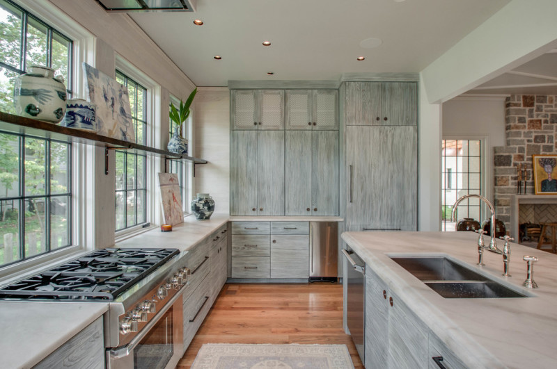 Beautiful marble, glass, natural wood kitchen designed by Jeffrey Dungan. https://kristywicks.com