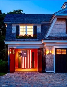 Exterior of Martha's Vineyard Home at night with American Flag. https://kristywicks.com